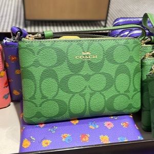 Coach Corner Zip Wristlet In Signature Canvas
Im/Neon Green